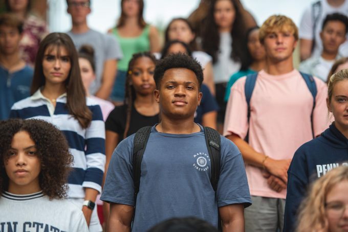 Bunch of students standing staggered on a stair set in casual Penn State clothes