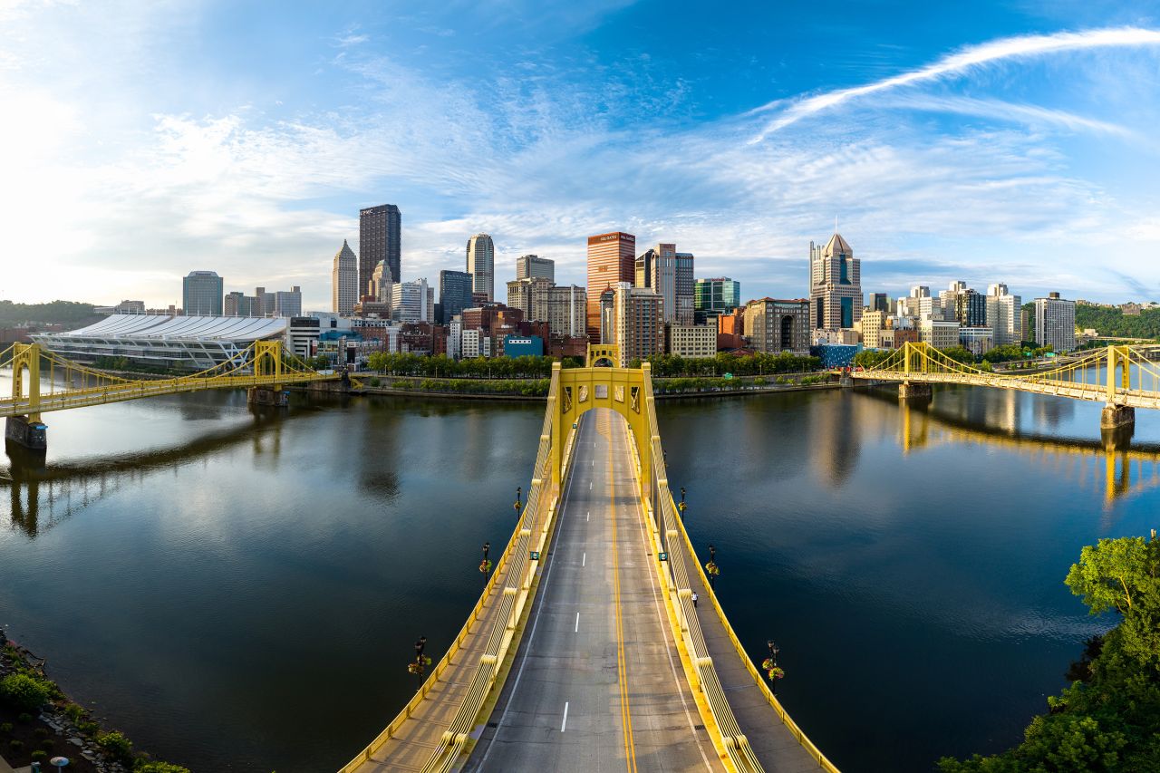 View of the downtown Pittsburgh skyline as viewed across a yellow span bridge, the Warhol Bridge